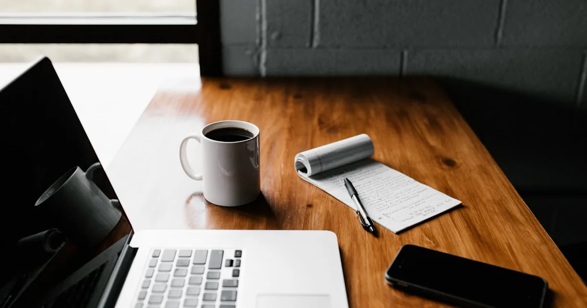 Laptop and notebook for writing, used for creating Shopify policy and content pages

---

# content