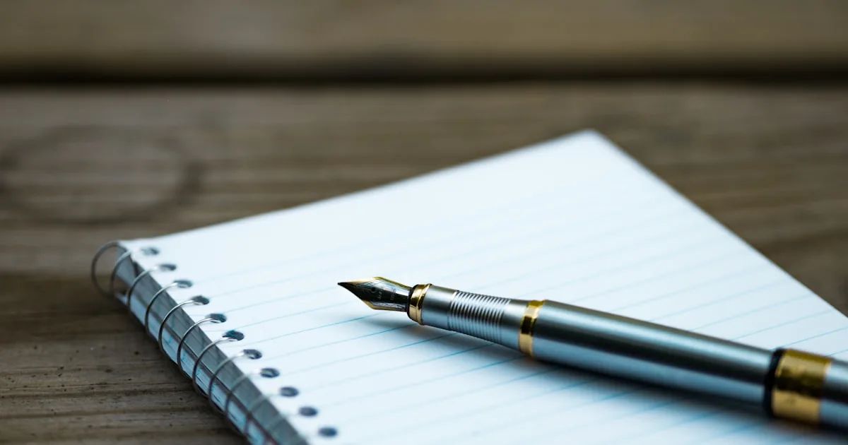 Notebook and product sample on a table, standing in for writing Shopify product copy

---

# content