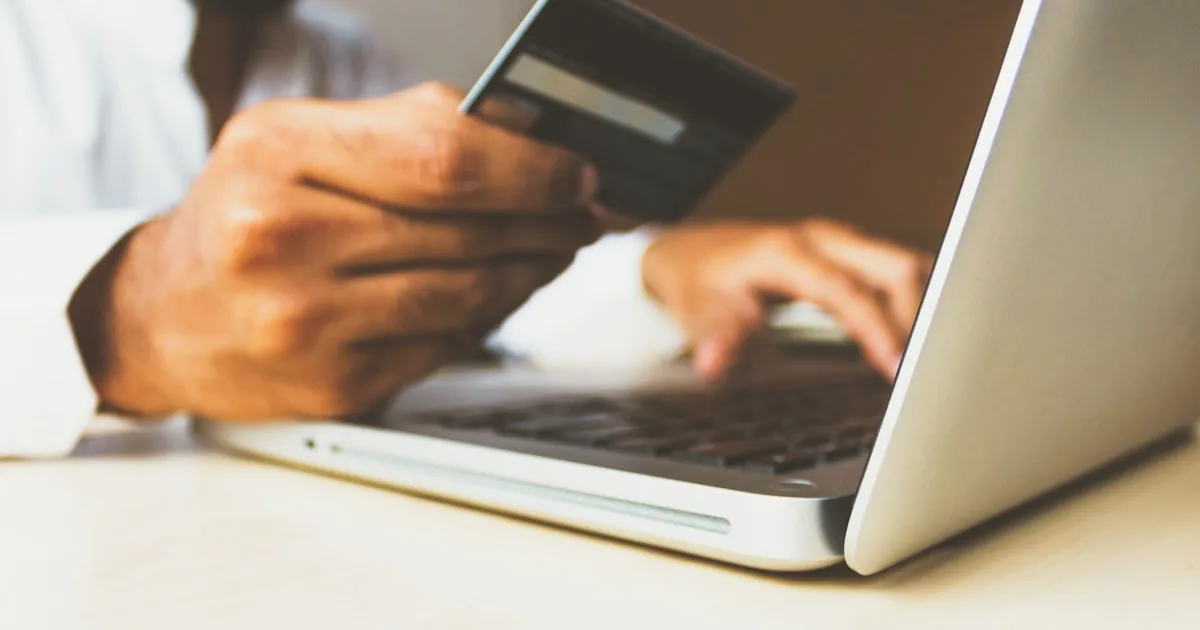 Credit cards and a payment terminal, used to explain Shopify payment gateways and processors